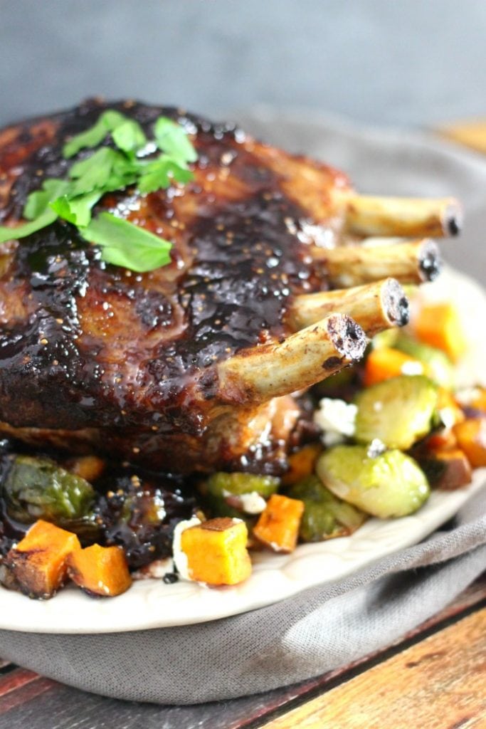 Fig Glazed Rack of Pork with Roasted Brussels Sprouts and Sweet Potatoes Recipe