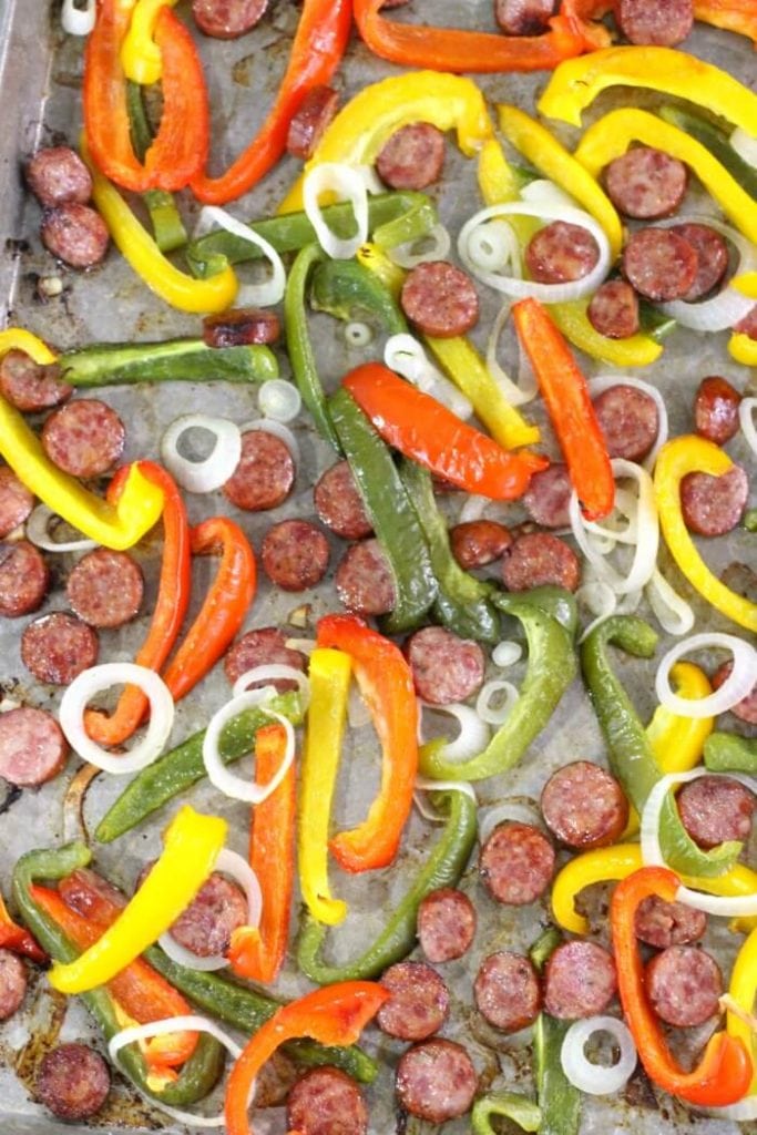 sausage and peppers roasted on a baking sheet