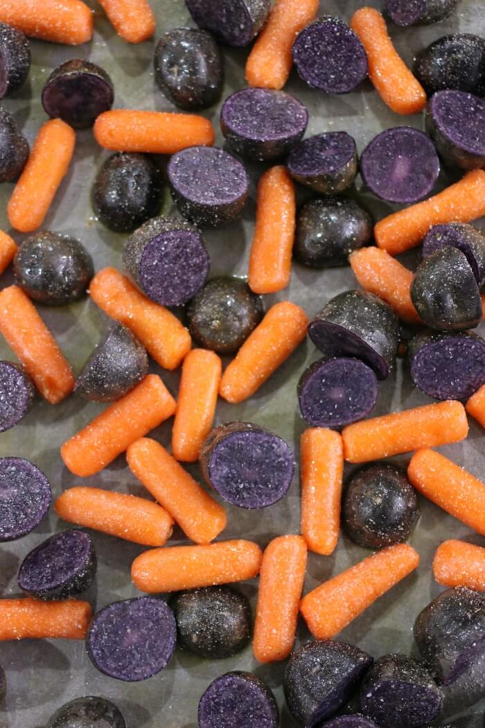 ROASTED PURPLE POTATOES AND CARROTS WITH GARLIC AND BUTTER