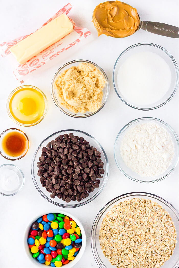 Monster cookie bars are ooey gooey peanut butter, oatmeal, and M&M filled dessert bars that are bound to put a smile on your face! MONSTER COOKIE BAR INGREDIENTS