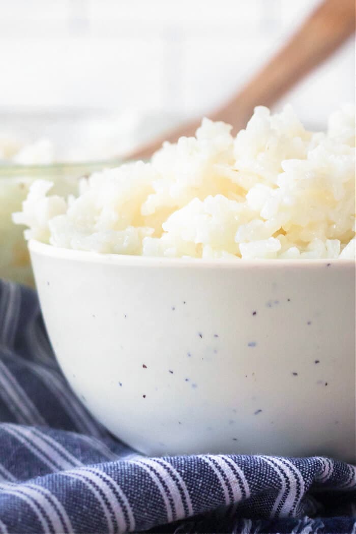 Baked rice is a foolproof way to make light and fluffy rice every time - no rice cooker, no problem! This rice is always perfect! BAKED RICE RECIPE