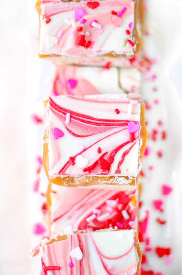 Valentine’s millionaire bars are a layered dessert made with shortbread, caramel, creamy chocolate and topped with Valentine sprinkles! CARAMEL SHORTBREAD VALENTINE'S MILLIONAIR BARS