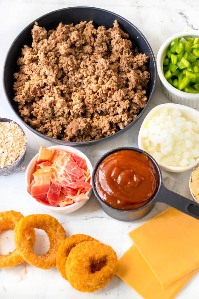 Cowboy sloppy joes are a fun spin on the original made with BBQ sauce, bacon, diced green peppers & onion served with crispy onion rings! COWBOY SLOPPY JOES INGREDIENTS