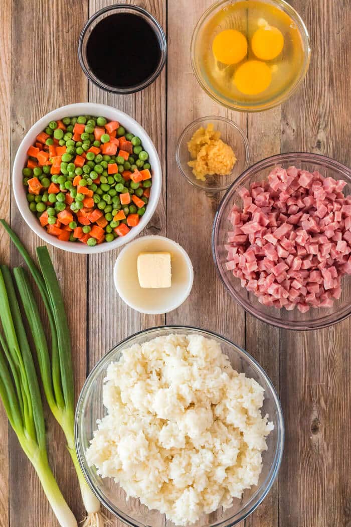 Ham fried rice is a flavorful and simple dish made with ham, peas, carrots, seasoned rice, and eggs topped for an easy weeknight meal! HAM FRIED RICE INGREDIENTS
