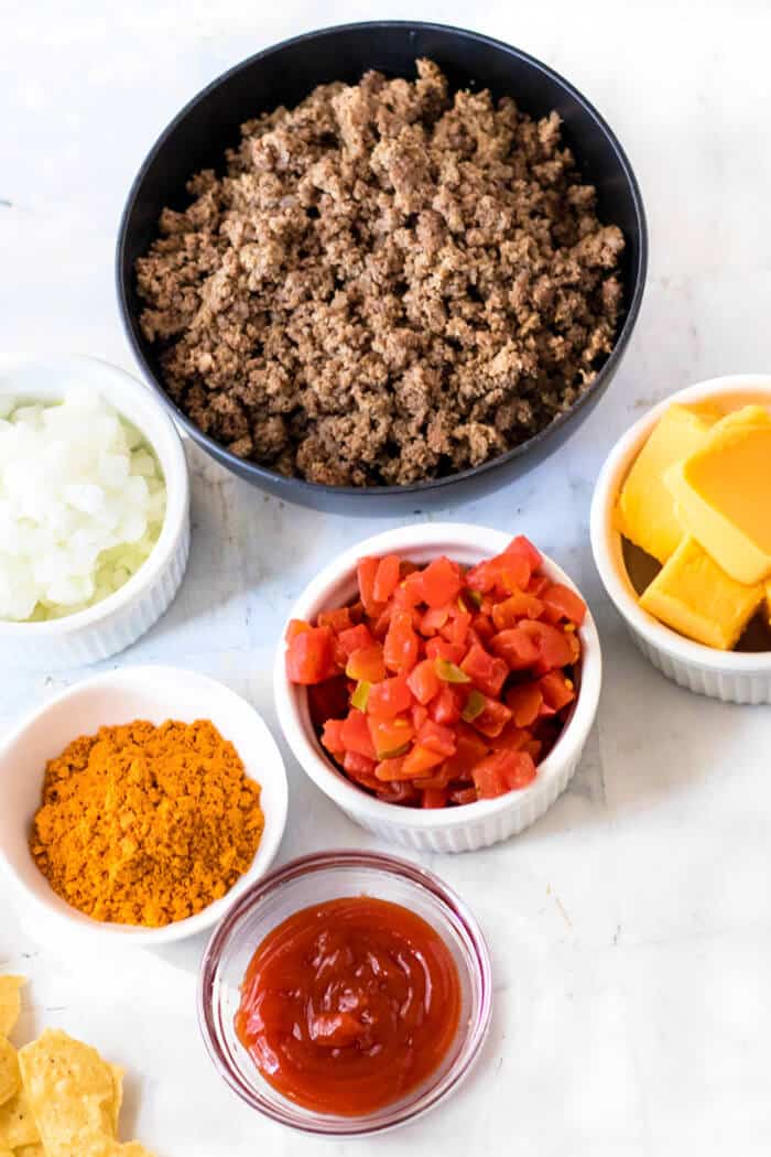 Nacho sloppy joes are a fun spin on the everyone's favorite sloppy sandwich made with ground beef, taco seasoning and melted cheese! NACHO SLOPPY JOE INGREDIENTS