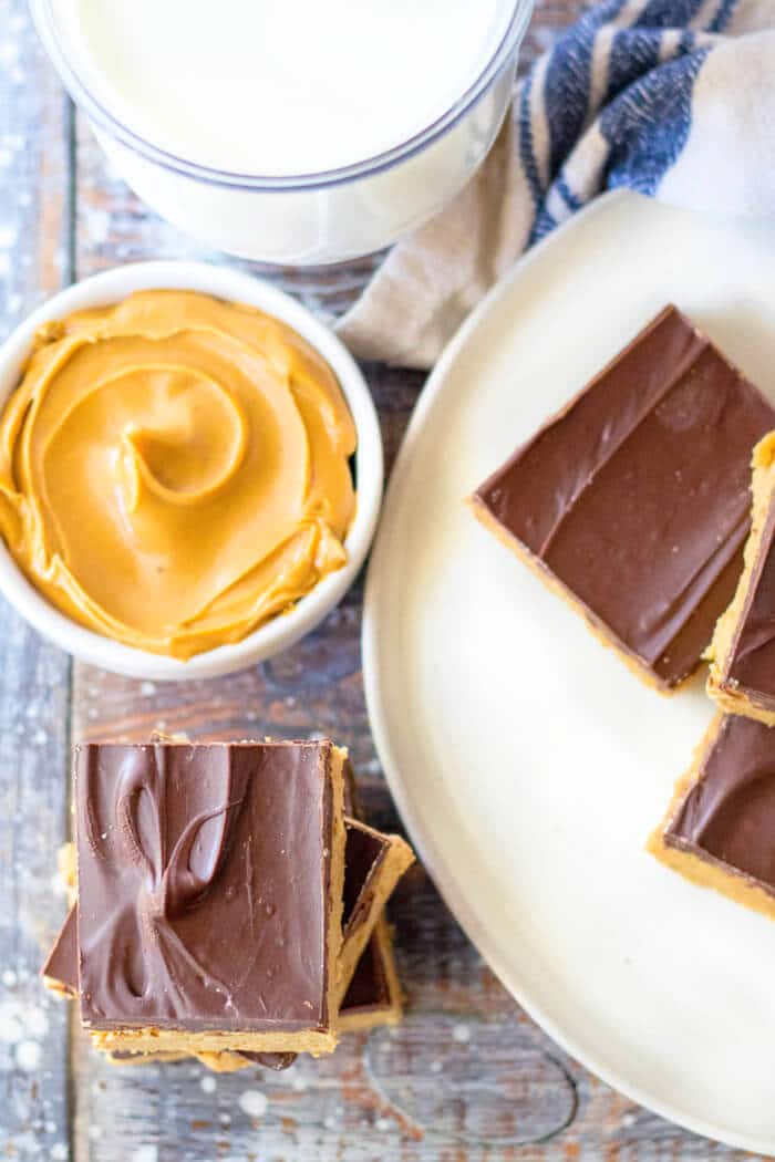 Peanut butter bars are a classic no bake peanut butter chocolate dessert bar we all know and love, they're delicious nostalgia! NO BAKE PEANUT BUTTER BARS RECIPE