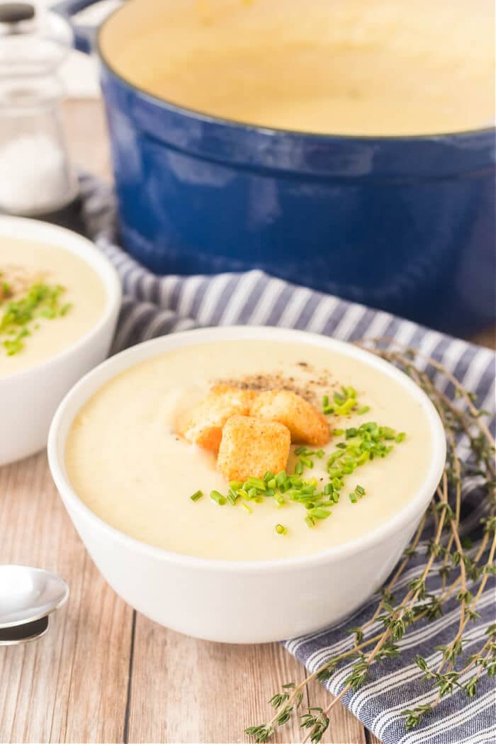 Potato leek soup is the perfect creamy soup for a cold winter day made with potatoes, leeks, chicken broth, heavy cream and fresh herbs. RECIPE FOR POTATO LEEK SOUP