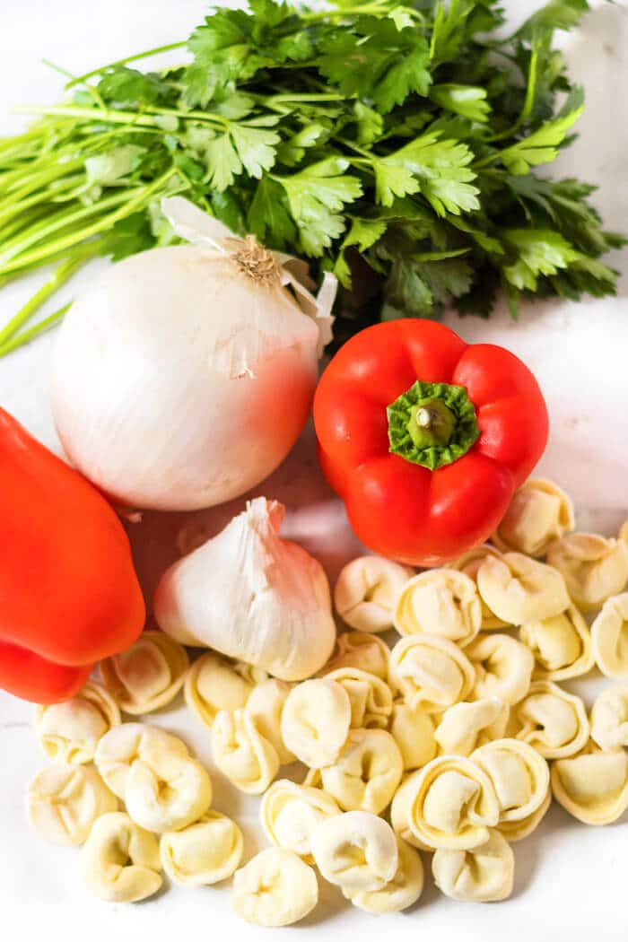 Roasted red pepper tortellini is a favorite dish made with red bell peppers, onion, garlic, and cheese tortellini! ROASTED RED PEPPER TORTELLINI INGREDIENTS