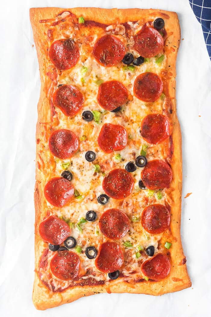 Crescent roll pizza is an easy shortcut for homemade pizza night, you just need crescent dough, sauce, cheese, and your favorite toppings! CRESCENT ROLL PIZZA RECIPE