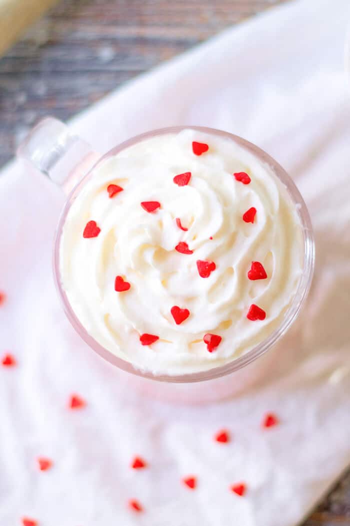 Pink hot chocolate is the perfect pink holiday or party treat; made with sweetened milk and white chocolate then topped with whipped cream! HOT CHOCOLATE PINK