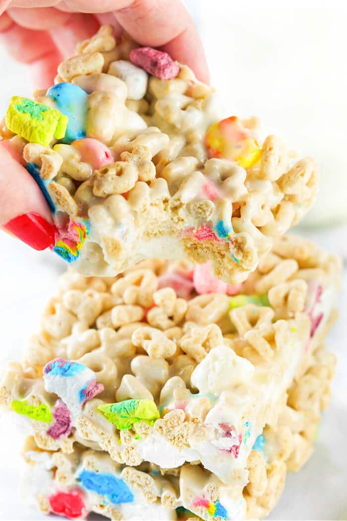 Lucky Charms rice krispie treats are a fun spin on the classic treats made with Lucky Charms cereal for a colorful and yummy dessert! LUCKY CHARMS MARSHMALOW TREATS