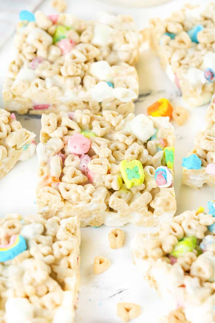 Lucky Charms rice krispie treats are a fun spin on the classic treats made with Lucky Charms cereal for a colorful and yummy dessert! LUCKY CHARMS TREATS