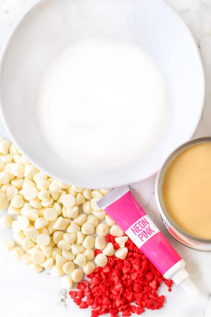 Pink hot chocolate is the perfect pink holiday or party treat; made with sweetened milk and white chocolate then topped with whipped cream! PINK HOT CHOCOLATE INGREDIENTS