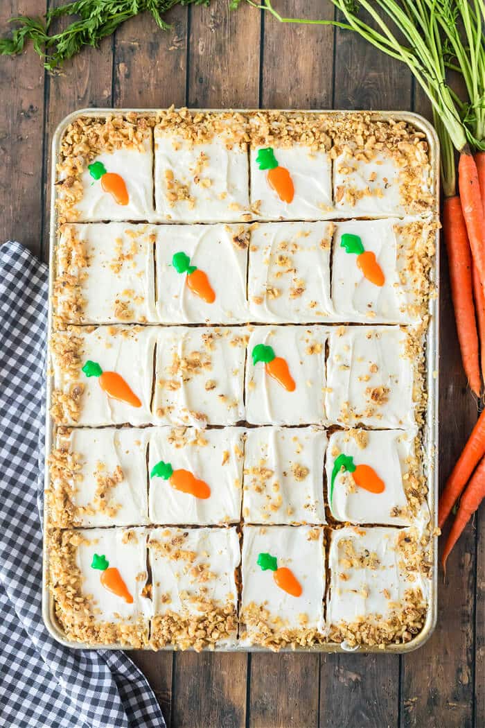 Carrot cake sheet cake is the perfect way to feed a crowd with a super moist homemade cake topped with cream cheese frosting and walnuts. SHEET CARROT CAKE