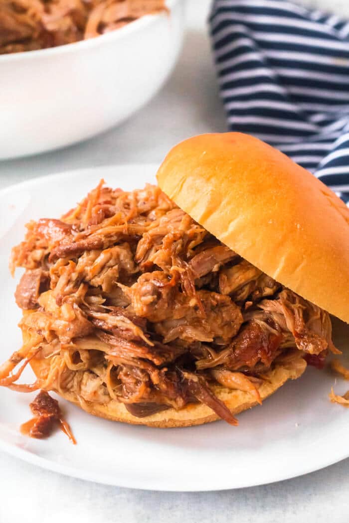 Dr. Pepper pulled pork is loaded with flavor from seasoning and Dr. Pepper and finished with BBQ sauce for an amazing weeknight meal. DR PEPPER PULLED PORK RECIPE