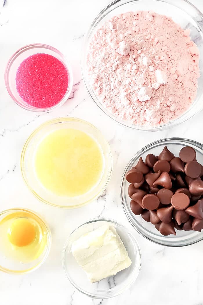 Strawberry kiss cookies are a fun spin on the original made with strawberry cake mix, cream cheese, sugar, and a delicious chocolate kiss! STRAWBERRY KISS COOKIE INGREDIENTS