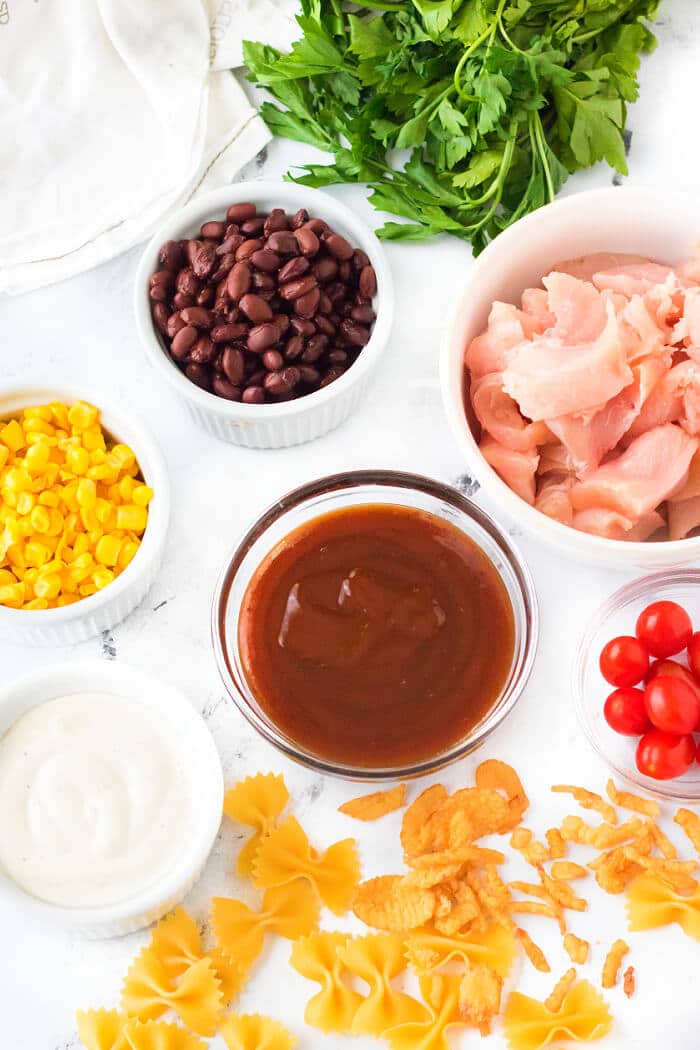 BBQ chicken pasta salad is the perfect side dish for any cookout made with BBQ chicken, ranch, tomatoes, corn, black beans & cilantro! BBQ CHICKEN PASTA SALAD INGREDIENTS
