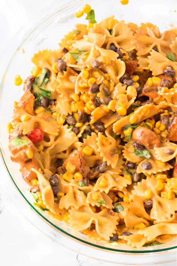 BBQ chicken pasta salad is the perfect side dish for any cookout made with BBQ chicken, ranch, tomatoes, corn, black beans & cilantro! BBQ CHICKEN PASTA SALAD RECIPE