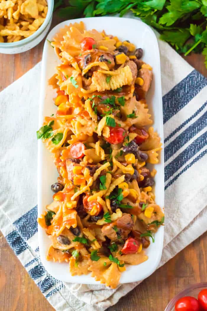 BBQ chicken pasta salad is the perfect side dish for any cookout made with BBQ chicken, ranch, tomatoes, corn, black beans & cilantro! BBQ RANCH CHICKEN PASTA SALAD