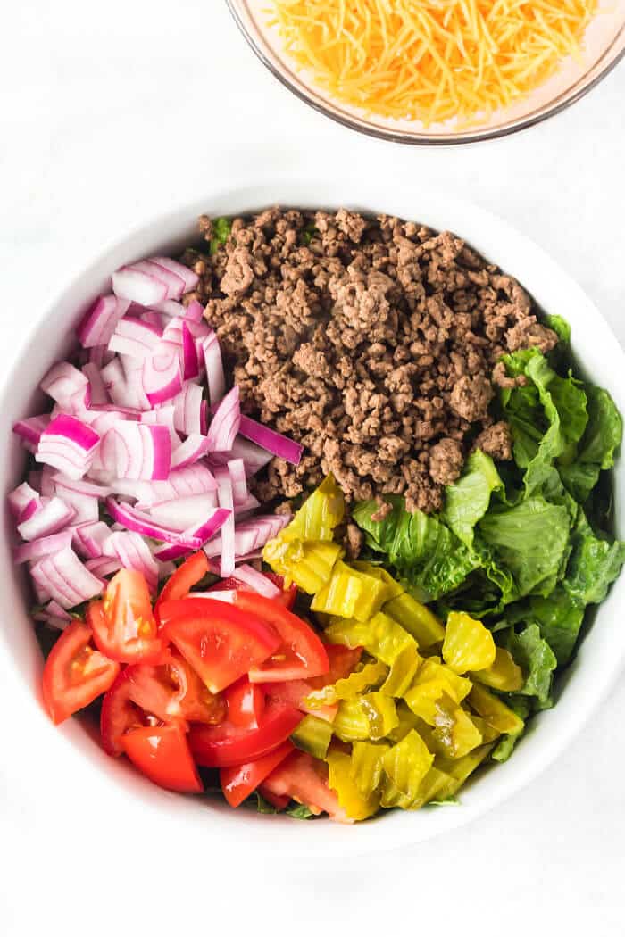 Big Mac salad is a fun spin on the classic burger served as a chopped salad with all the same great flavors including the secret sauce! BIG MAC SALAD