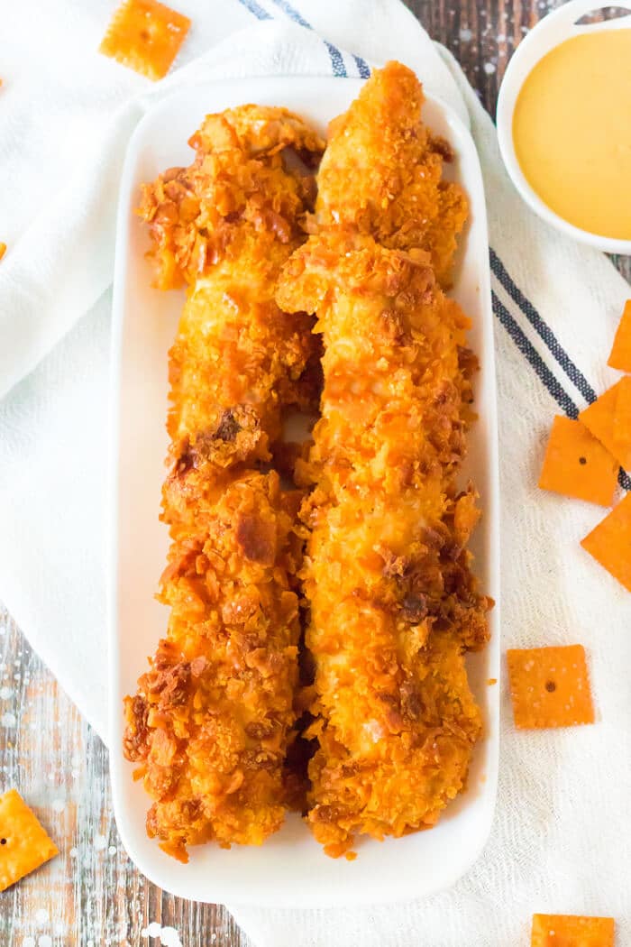 Cheez it chicken is a crunchy fun chicken dish with shredded cheddar cheese and Cheez-it crackers for a flavorful chicken tender! CHEEZ IT CHICKEN STRIPS