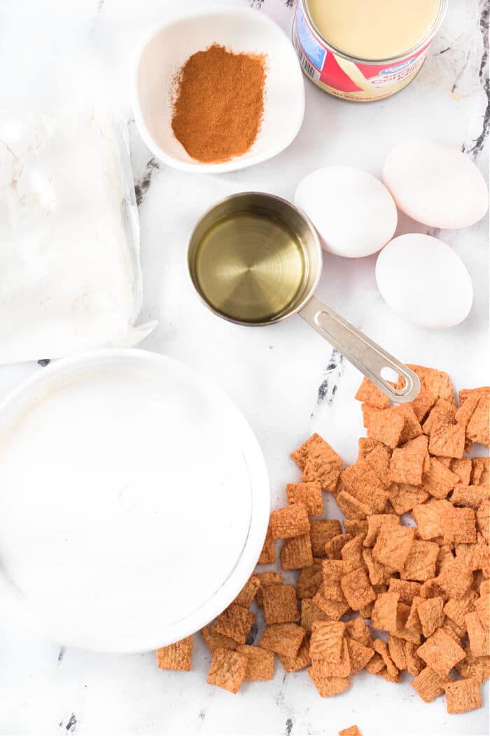 Cinnamon toast crunch poke cake combines cake mix, cinnamon, sweetened condensed milk, whipped topping & cinnamon toast crunch cereal! CINNAMON TOAST CRUNCH POKE CAKE INGREDIENTS