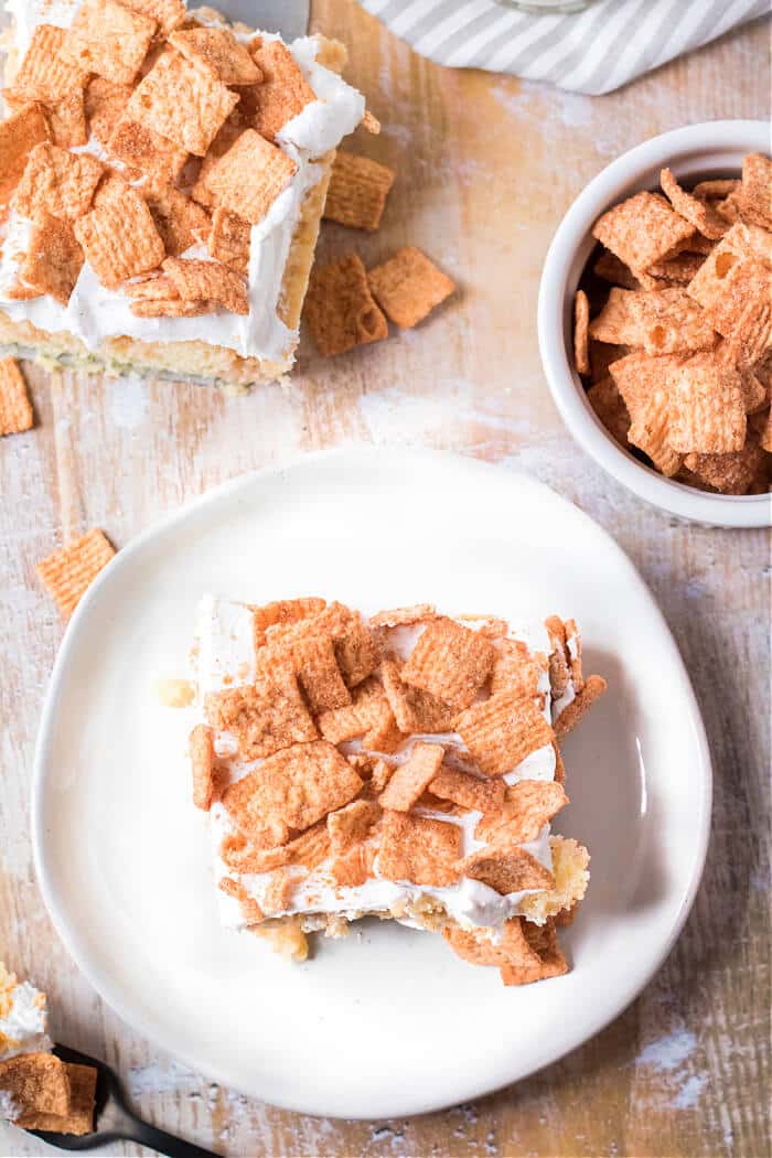 Cinnamon toast crunch poke cake combines cake mix, cinnamon, sweetened condensed milk, whipped topping & cinnamon toast crunch cereal! CINNAMON TOAST CRUNCH POKE CAKE RECIPE