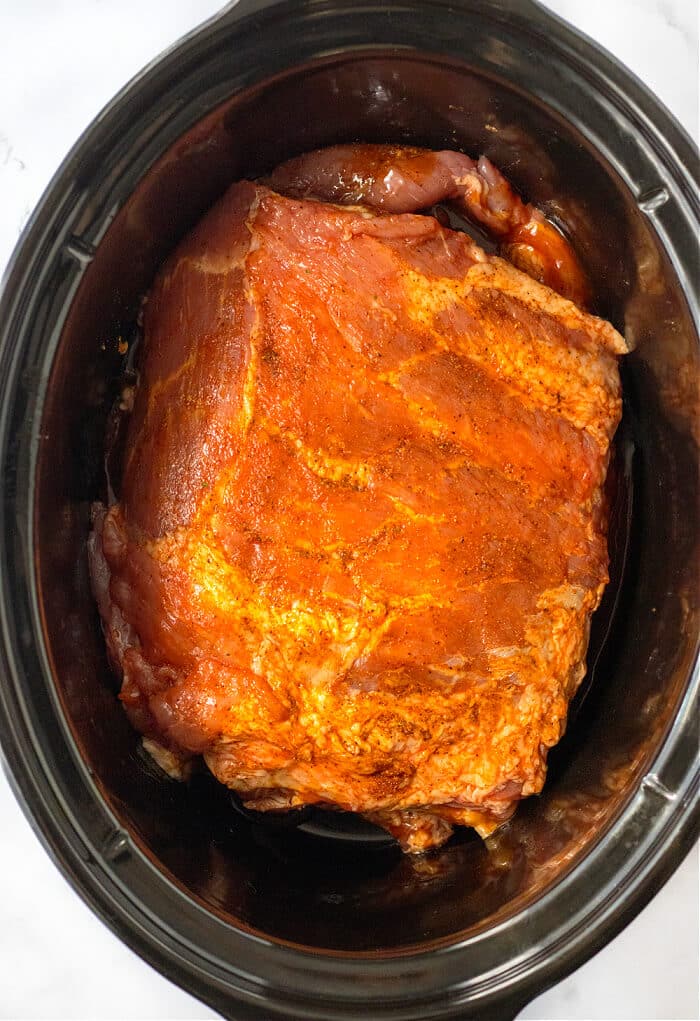 Slow cooker ribs are an easy and delicious way to have a tender and flavorful rack of ribs ready for supper at the end of a busy day! COOKING RIBS IN SLOW COOKER