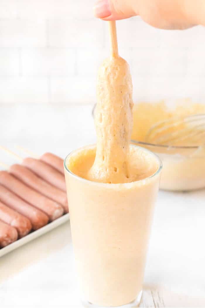 Homemade corn dogs are a delicious treat made with hot dogs, corn meal, buttermilk and honey for nostalgic perfection. CORN DOG RECIPE BATTER