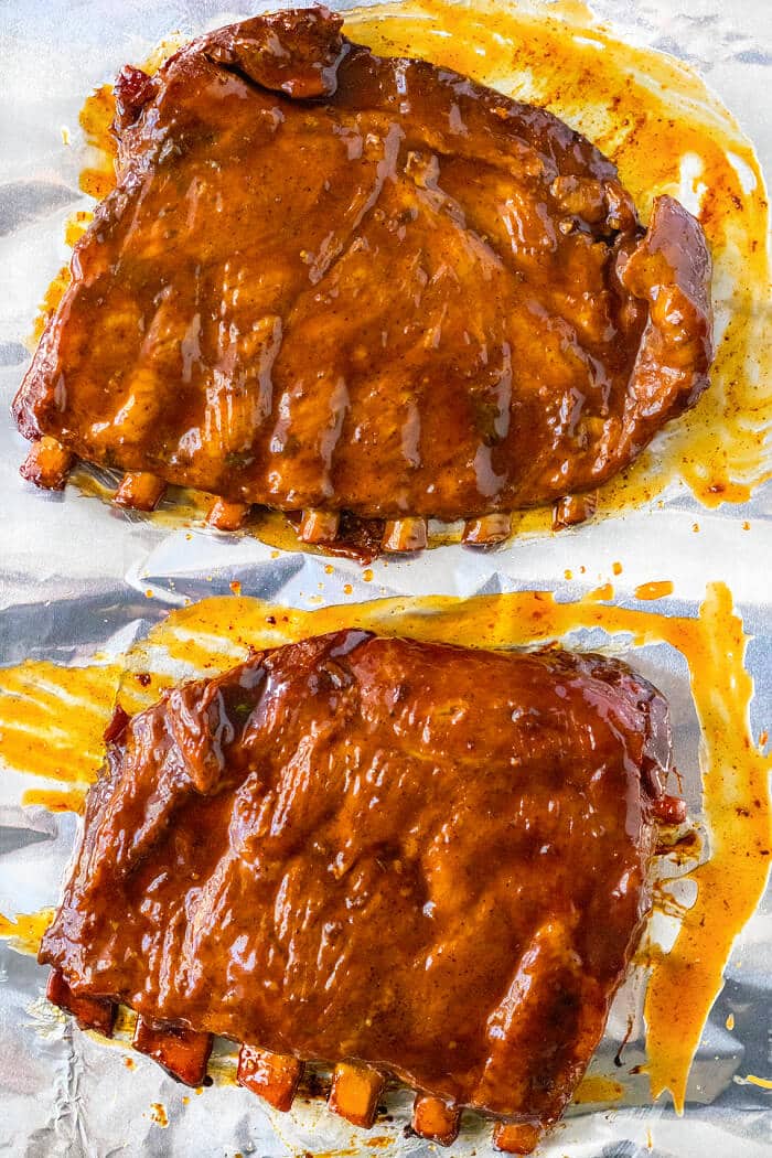 Slow cooker ribs are an easy and delicious way to have a tender and flavorful rack of ribs ready for supper at the end of a busy day! CROCK POT RIBS