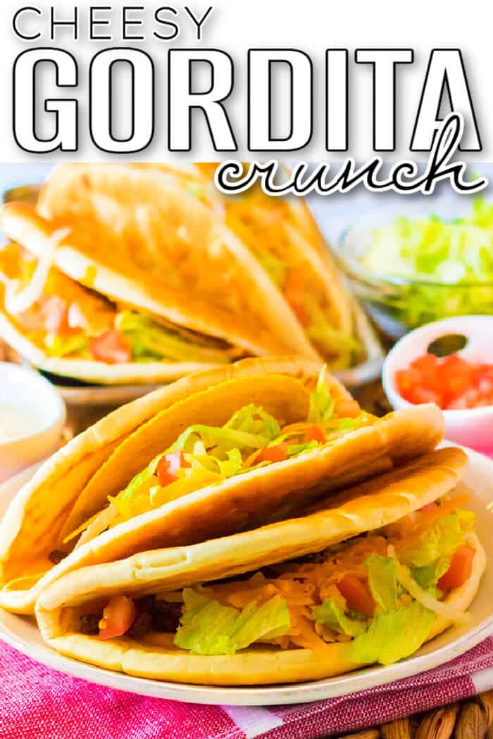 Cheesy Gordita crunch is a crunchy taco with a hard shell wrapped in a pita stuffed with beef, spicy ranch, lettuce, tomato, & more cheese! EASY CHEESY GORDITA CRUNCH