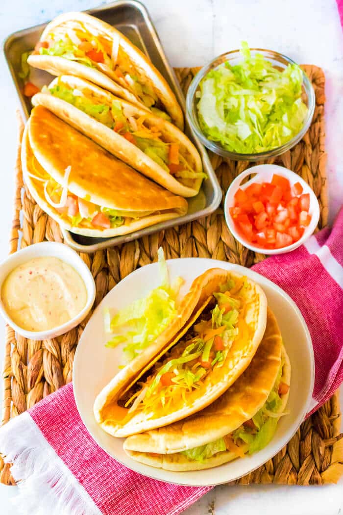Cheesy Gordita crunch is a crunchy taco with a hard shell wrapped in a pita stuffed with beef, spicy ranch, lettuce, tomato, & more cheese! GORDITA CRUNCH