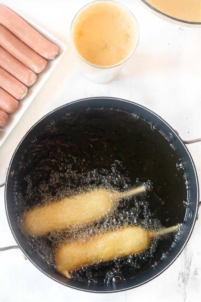 Homemade corn dogs are a delicious treat made with hot dogs, corn meal, buttermilk and honey for nostalgic perfection. HOMEMADE CORN DOG RECIPE