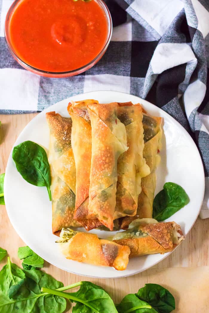 Air fryer spinach mozzarella sticks are an easy recipe made with egg roll wrappers, string cheese and baby spinach for crispy cheese sticks! HOMEMADE MOZZARELLA STICKS AIR FRYER