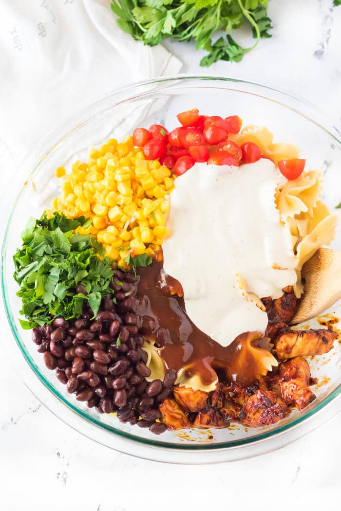 BBQ chicken pasta salad is the perfect side dish for any cookout made with BBQ chicken, ranch, tomatoes, corn, black beans & cilantro! HOW TO MAKE BBQ CHICKEN PASTA SALAD
