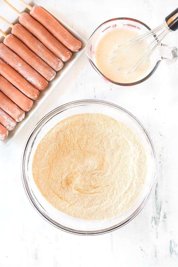 Homemade corn dogs are a delicious treat made with hot dogs, corn meal, buttermilk and honey for nostalgic perfection. HOW TO MAKE CORN DOGS AT HOME