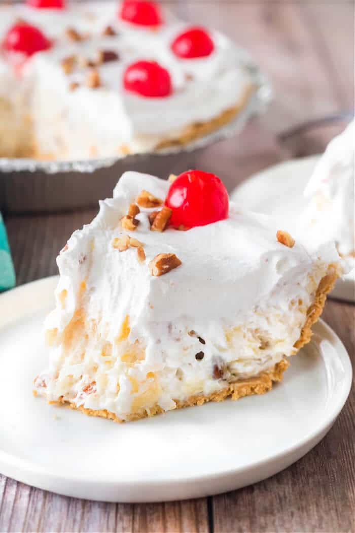 Millionaire pie is a creamy no-bake pie in a graham cracker crust with lemon juice, sweetened condensed milk, pineapple and coconut flakes! MILLIONAIRES PIE