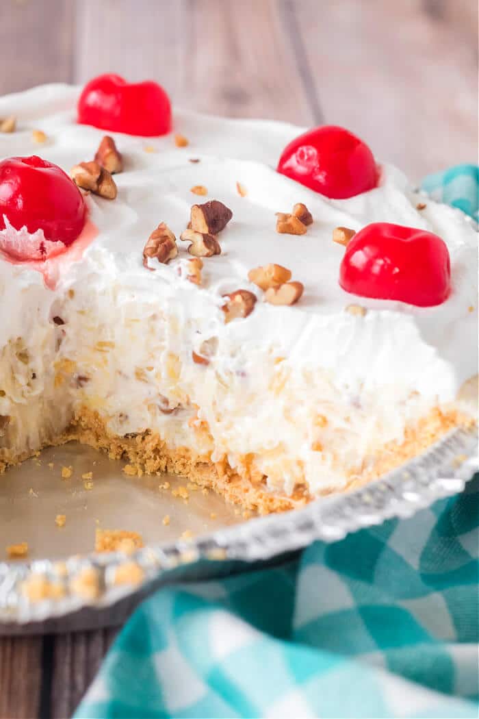 Millionaire pie is a creamy no-bake pie in a graham cracker crust with lemon juice, sweetened condensed milk, pineapple and coconut flakes! MILLIONAIRES PIE RECIPE