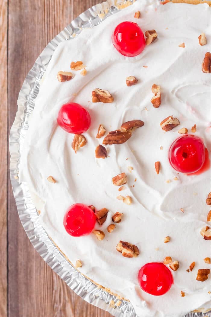 Millionaire pie is a creamy no-bake pie in a graham cracker crust with lemon juice, sweetened condensed milk, pineapple and coconut flakes! RECIPE FOR MILLIONAIRES PIE