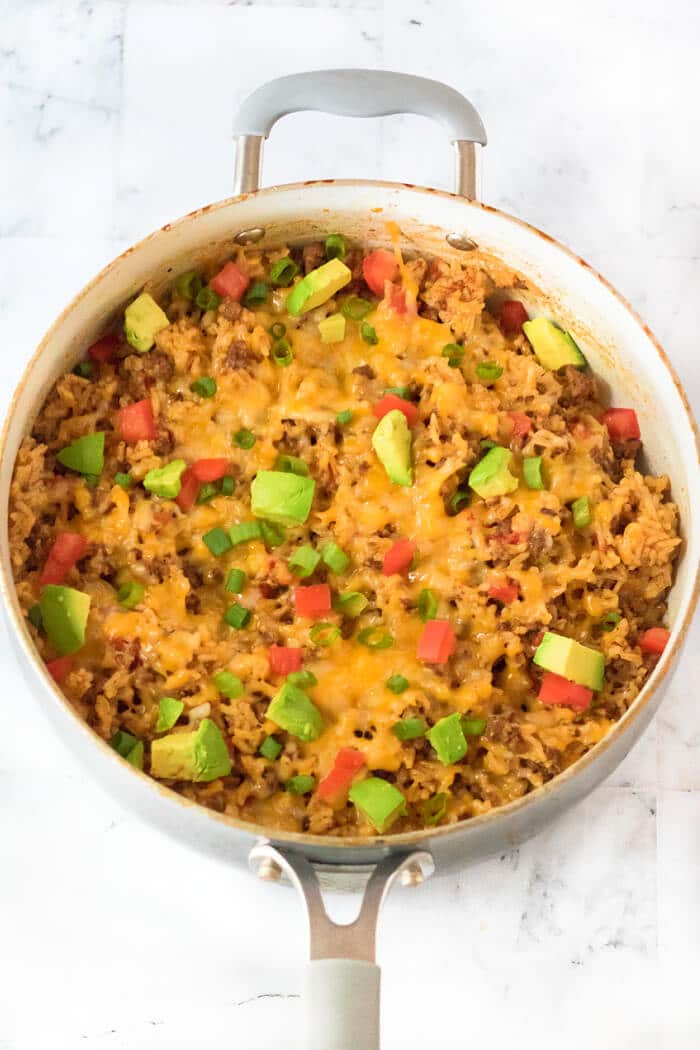 Taco rice is a fantastic one pot meal made with ground beef, taco seasoning, rotel tomatoes, rice and colby jack cheese. TACO RICE WITH GROUND BEEF
