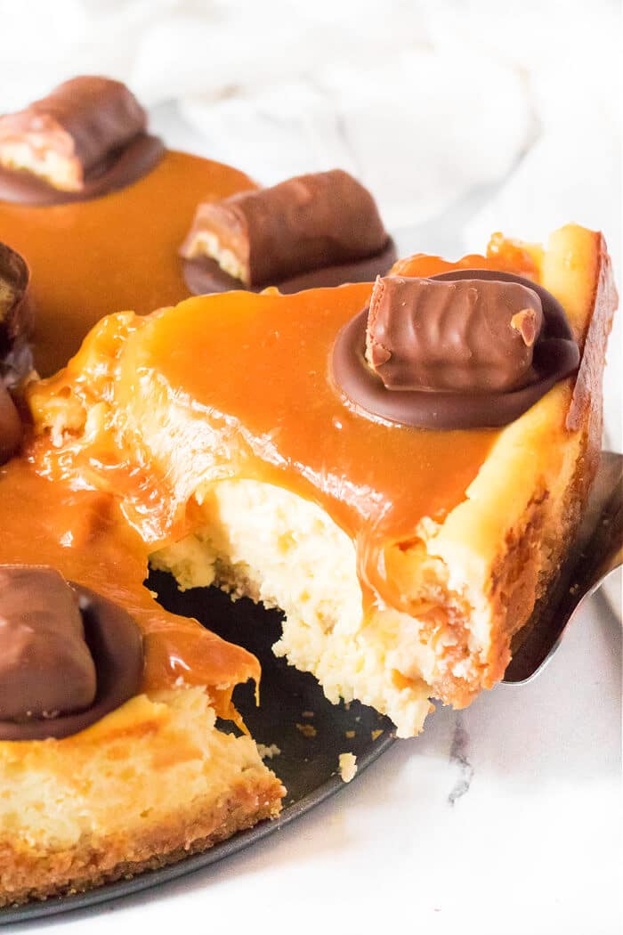 Twix cheesecake is a delightful dessert made with a cookie crust and homemade cheesecake topped with caramel, chocolate and of course, Twix! TWIX CHEESECAKE