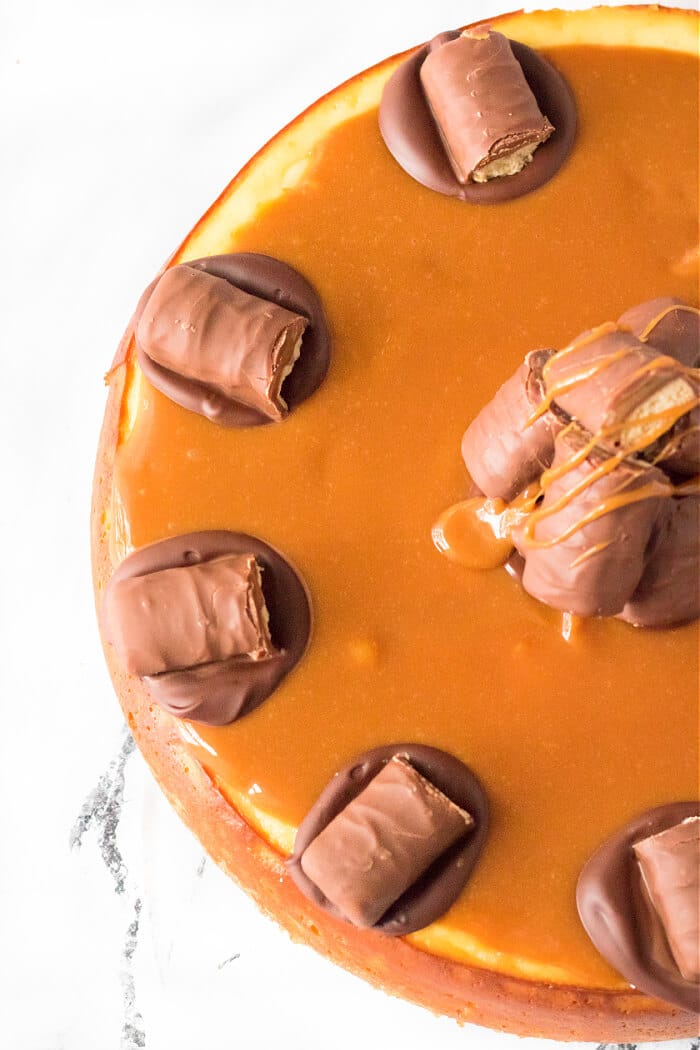 Twix cheesecake is a delightful dessert made with a cookie crust and homemade cheesecake topped with caramel, chocolate and of course, Twix! TWIX CHEESECAKE RECIPE