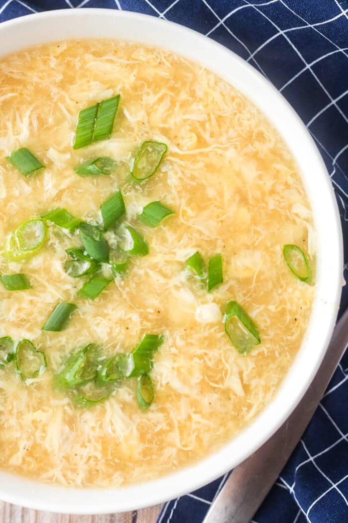 Egg drop soup is a classic dish made with savory broth, ginger, sesame oil and green onions and finished with silky ribbons of egg! EGG DROP SOUP