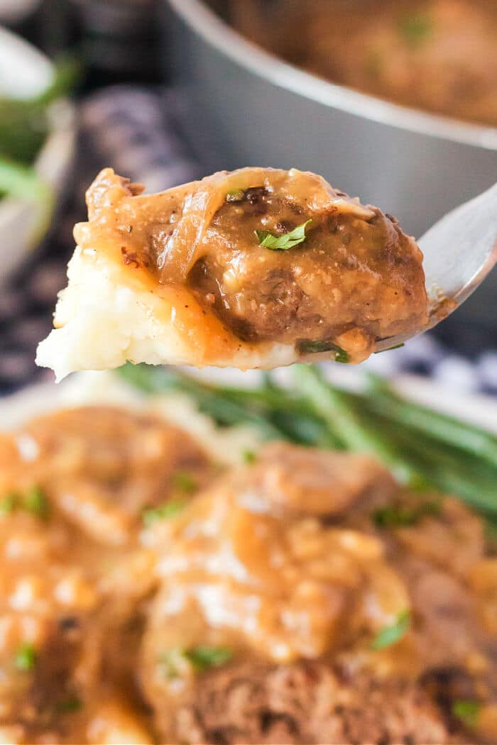 Salisbury steak is a classic dish made with seasoned ground beef cooked with sautéed mushrooms and onions in a delicious homemade gravy! OLD FASHIONED SALISBURY STEAK