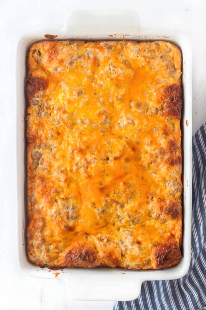 Biscuits and gravy casserole is one of our favorite breakfasts made with breakfast sausage, biscuits and a homemade gravy topped with cheese! SAUSAGE BISCUITS AND GRAVY CASSEROLE RECIPE